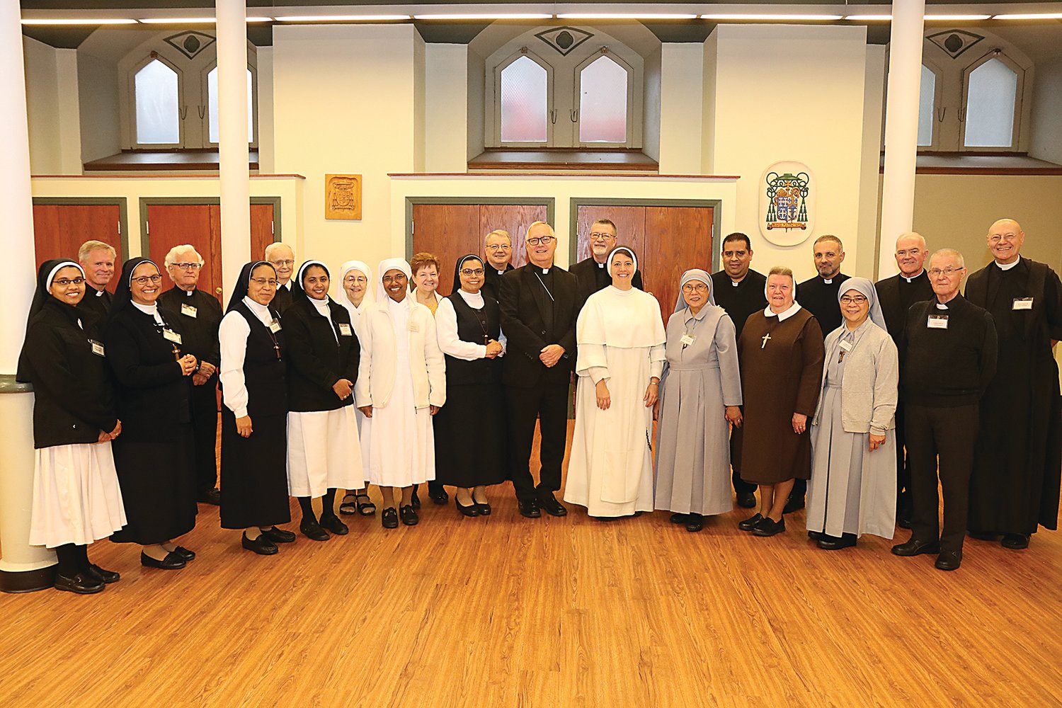 Bishop Thomas J. Tobin stands with representatives of the 32 communities of religious women and 12 communities of religious men in the Diocese of Providence during the annual Major Superiors meeting, held Oct. 26 at the Cathedral of SS. Peter and Paul.